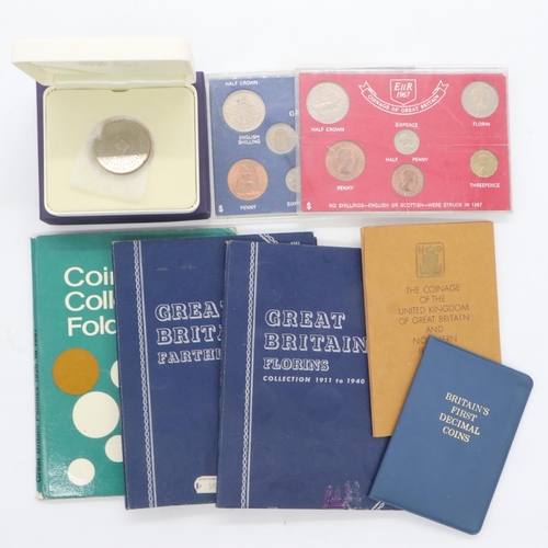 140 - Coin sets, partly populated Whitman folders and a cased £5 coin.P&P Group 2 (£20+VAT for the first l... 