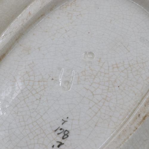 227 - Nine relief moulded fish plates, one platter and one sauce bowl with stand, crazing and some cracks,... 