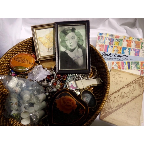 1152 - Basket of mixed items to include jewellery, Coronation Street ephemera, and a David Bowie single . N... 