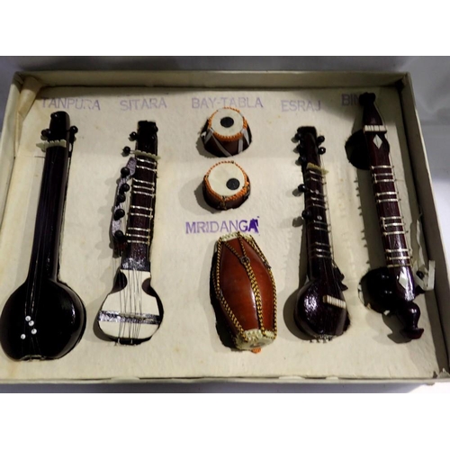 1167 - Seven Indian miniature wooden instruments, Largest L: 17 cm. Not available for in-house P&P