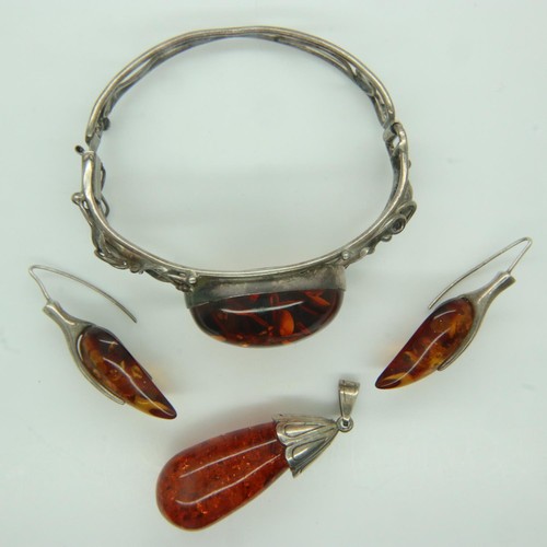 96 - ***WITHDRAWN***Baltic amber jewellery mounted on sterling silver to include a pendant, earrings and ... 