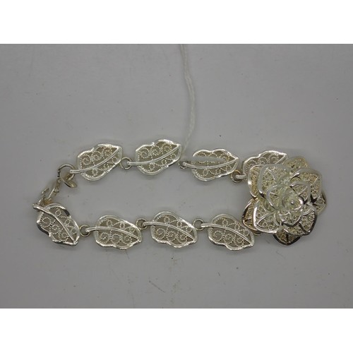 86 - 925 silver bracelet, made up of central flower and leaf shape links. UK P&P Group 0 (£6+VAT for the ... 