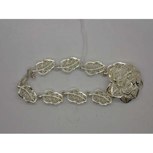 86 - 925 silver bracelet, made up of central flower and leaf shape links. UK P&P Group 0 (£6+VAT for the ... 