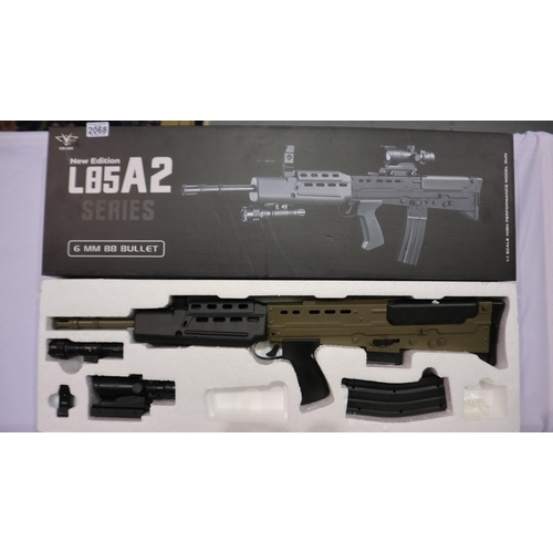 2068 - New old stock spring powered 6mm BB rifle in black/green (L85 A1 style), boxed. UK P&P Group 3 (£30+... 