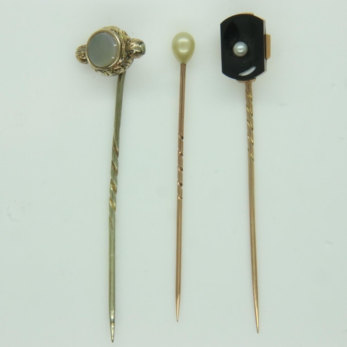 77 - Three antique gold stick pins, set with pearl, onyx and chalcedony, 5.3g. UK P&P Group 0 (£6+VAT for... 