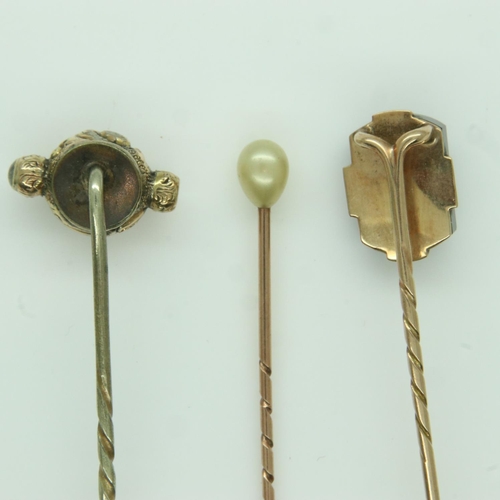 77 - Three antique gold stick pins, set with pearl, onyx and chalcedony, 5.3g. UK P&P Group 0 (£6+VAT for... 