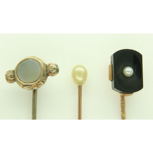 77 - Three antique gold stick pins, set with pearl, onyx and chalcedony, 5.3g. UK P&P Group 0 (£6+VAT for... 