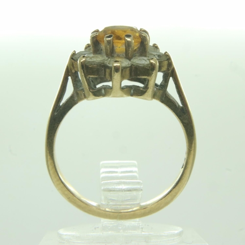 78 - 9ct gold stone set daisy-head ring, size J/K, 2.9g. UK P&P Group 0 (£6+VAT for the first lot and £1+... 