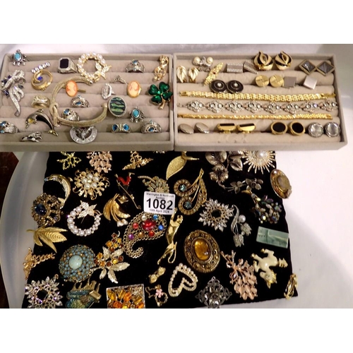 1082 - Two trays of rings, brooches, cufflinks and bracelets, and a tray of forty five brooches. UK P&P Gro... 