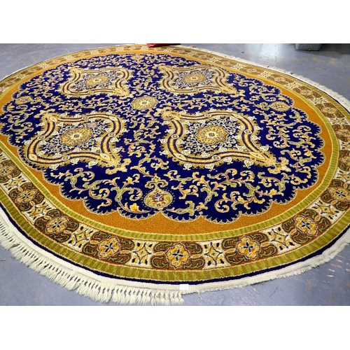 2077 - A large oval blue ground rug in the Middle-Eastern manner, 350 x 280 cm, some fringe missing. Not av... 