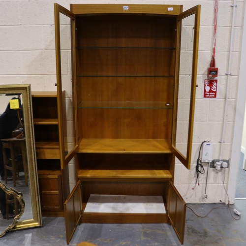 2067 - Nathan Squares illuminated display cabinet, two doors and three glass shelves above a two-door cupbo... 