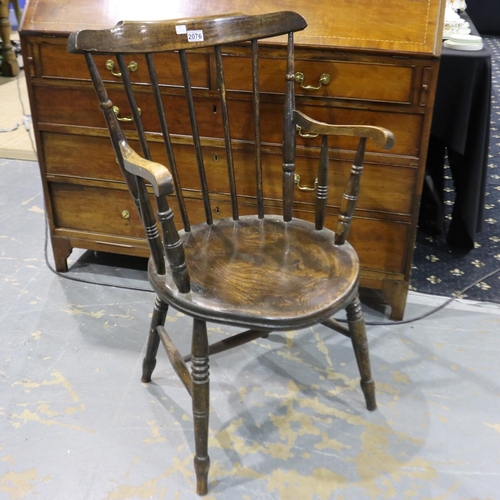 2076 - A 19th century elm stick-back country kitchen chair with circular seat and carved supports. Not avai... 