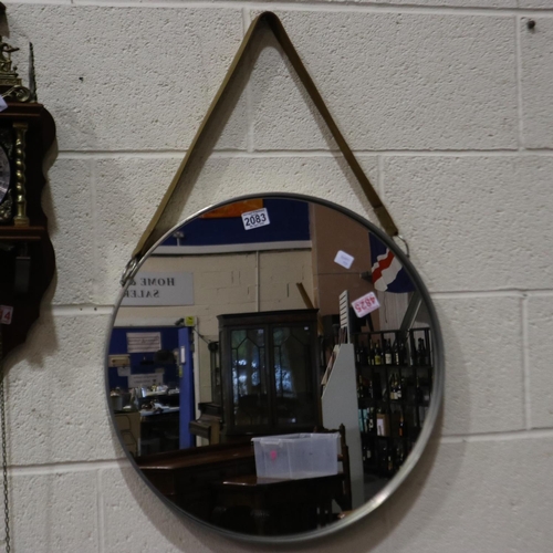 2083 - John Lewis circular mirror, suspends from a wide leather strap, D: 52cm. Not available for in-house ... 