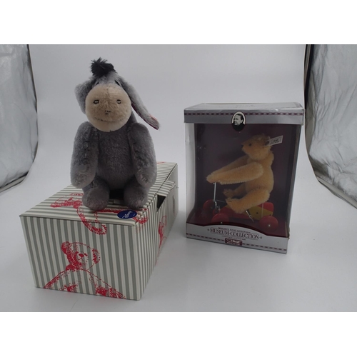 2452 - Two Steiff, a Mini Eyore, 683541 and a clockwork UR-Teddy 1926, 400919, both boxed with tags. UK P&P... 