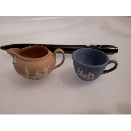 1089 - Miniature Wedgwood jasperware pink jug and blue teacup. UK P&P Group 1 (£16+VAT for the first lot an... 