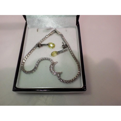 1105 - Silver peridot set earrings and white metal stone set bracelet, L: 16 cm. UK P&P Group 1 (£16+VAT fo... 