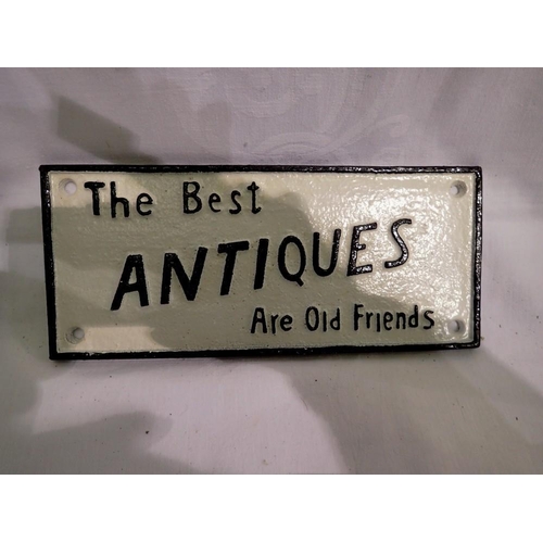 1242 - Cast iron sign, The Best Antiques Are Old Friends, L: 22 cm. UK P&P Group 1 (£16+VAT for the first l... 