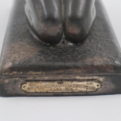 189 - Spelter kneeling deity with plaque for the 1931 Paris Exposition Colonials, H: 29 cm. UK P&P Group 2... 