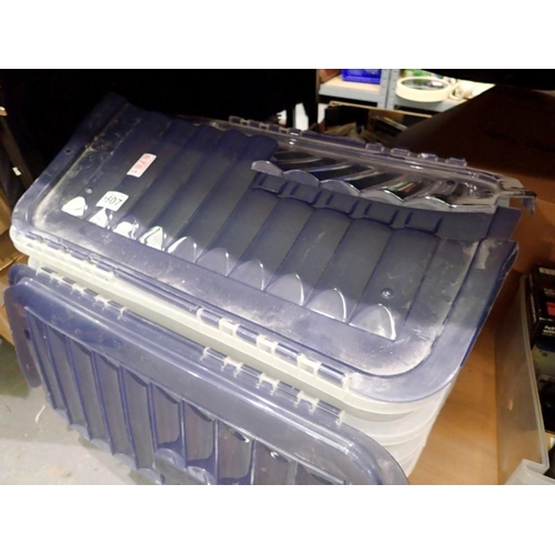 1607 - Four plastic lidded storage boxes. Not available for in-house P&P