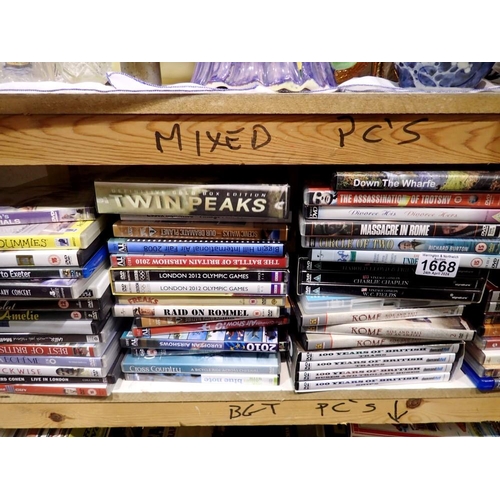 1668 - Shelf of mixed DVDs. Not available for in-house P&P