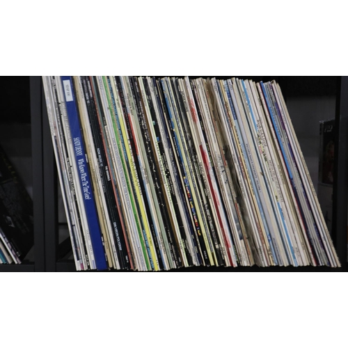 438 - Approximately one hundred mixed pop and other LPs. Not available for in-house P&P