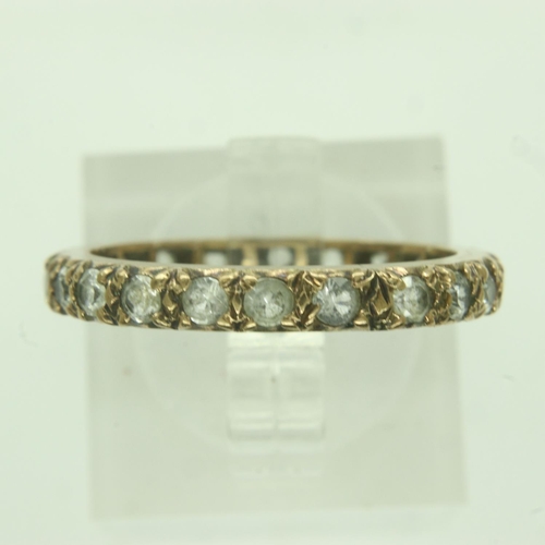 15 - 9ct gold stone set eternity ring, unmarked, size N, 2.2g. UK P&P Group 0 (£6+VAT for the first lot a... 