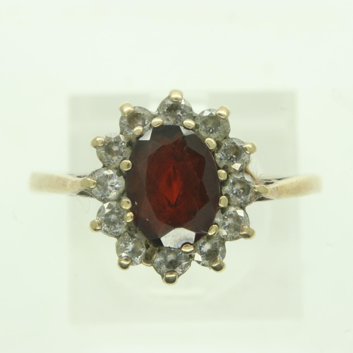 28 - 9ct gold ring set with garnet and cubic zirconia, size U, 2.2g. UK P&P Group 0 (£6+VAT for the first... 