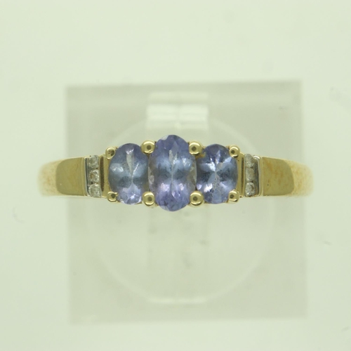 42 - Modern 14ct gold ring set with blue topaz and diamonds, size P, 2.3g. P&P Group 0 (£6+VAT for the fi... 