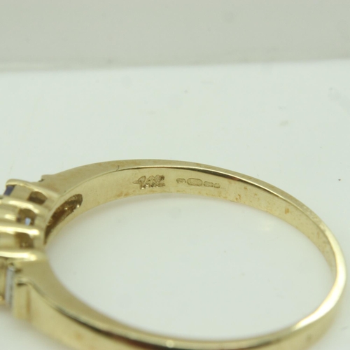 42 - Modern 14ct gold ring set with blue topaz and diamonds, size P, 2.3g. P&P Group 0 (£6+VAT for the fi... 