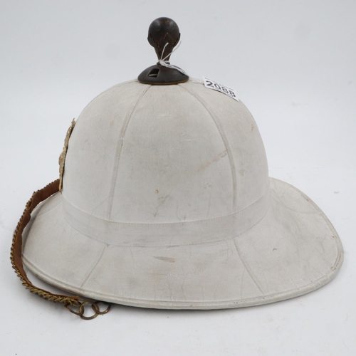 2088 - 1960 dated Royal Marines Band pith helmet. with liner, badge, chin strap and top pommel. UK P&P Grou... 