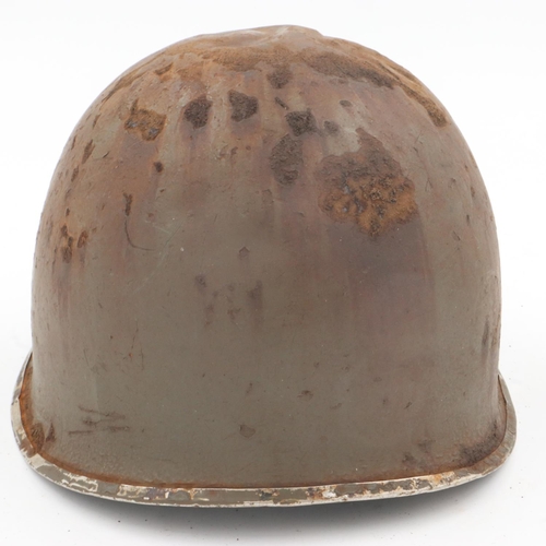 2093 - WWII US M1 Swivel Bale Helmet, with insignia of the 8th Infantry Division. This helmet has the typic... 