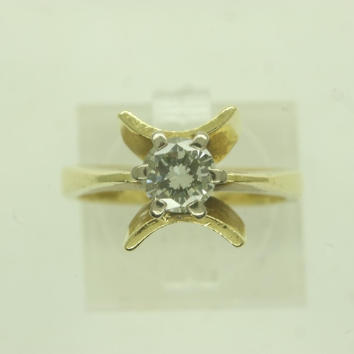 11 - 18ct gold solitaire diamond ring, unusual raised claw setting with the bright stone approximately 0.... 