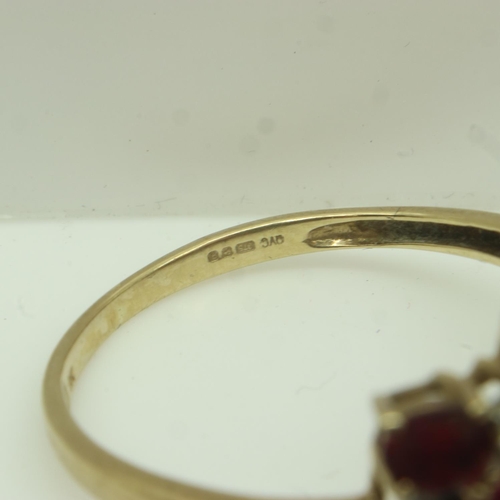 13 - 9ct gold ring set with rubies and diamonds, size U, 2.8g. UK P&P Group 0 (£6+VAT for the first lot a... 