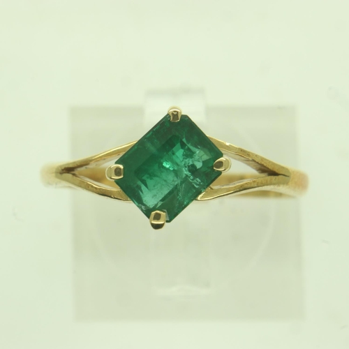 16 - 18ct gold emerald-set solitaire ring, the stone emerald-cut in a split setting, size O/P, 2.4g. UK P... 