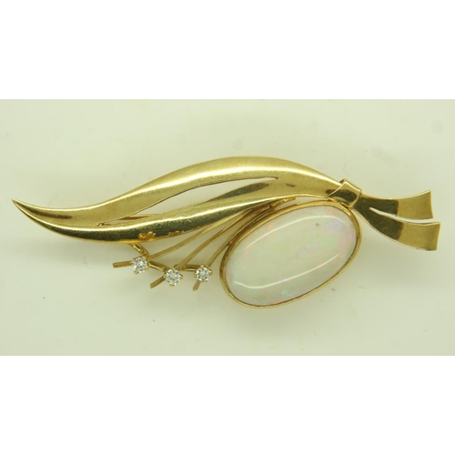 29 - Continental gold brooch (unmarked), set with a large oval cabochon opal and three diamonds, L: 65 mm... 