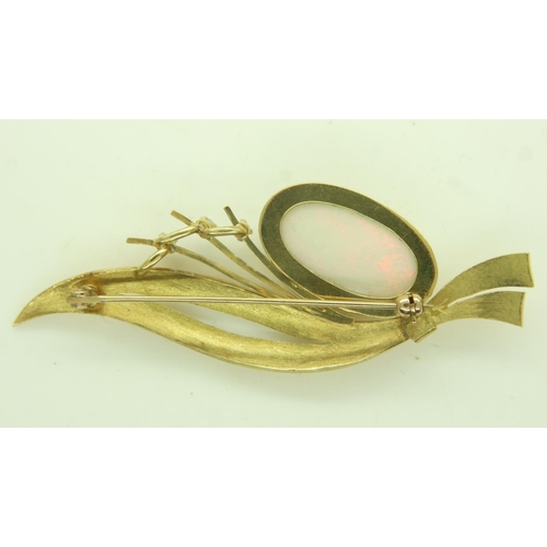 29 - Continental gold brooch (unmarked), set with a large oval cabochon opal and three diamonds, L: 65 mm... 