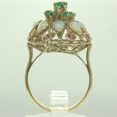 42 - Eastern 14ct gold target ring, set with a multitude of emeralds, teardrop opals and rubies, size P, ... 