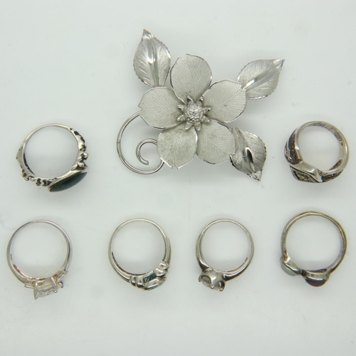 50 - Six stone-set silver rings and a silver floral brooch. UK P&P Group 0 (£6+VAT for the first lot and ... 