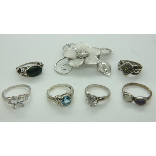 50 - Six stone-set silver rings and a silver floral brooch. UK P&P Group 0 (£6+VAT for the first lot and ... 