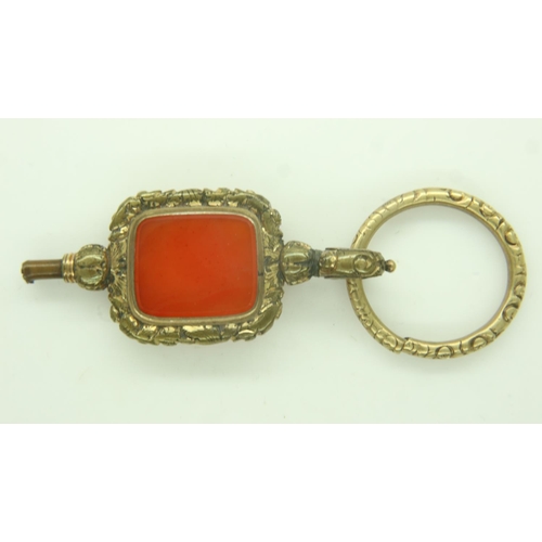 59 - A 19th century over-sized gilt-metal pocket watch key, set with a panel of agate. P&P Group 0 (£6+VA... 