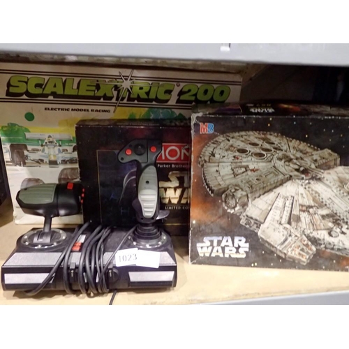 1023 - Three boxed games to include a 3D Star Wars puzzle and a Quickshot driving joystick. Not available f... 