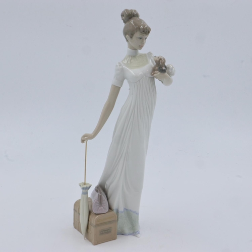 229 - Lladro figurine of a girl with a suitcase, H: 35 cm, no chips or cracks. UK P&P Group 2 (£20+VAT for... 