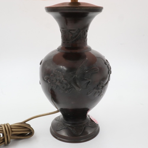 256 - Oriental bronze table lamp with shade, decorated with birds and cherry blossom, H: 53 cm. All electr... 