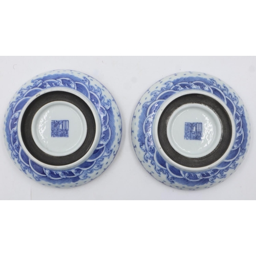 260 - Pair of Chinese blue and white covered bowls with dragon decoration, each raised on a wooden stand, ... 