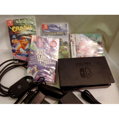 1130 - Nintendo Switch docking station and accessories, includes three unopened games. UK P&P Group 1 (£16+... 