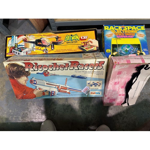 1024 - Three boxed board games to include Ricochet Racers, Batman bat copter ( missing parts), Race space e... 