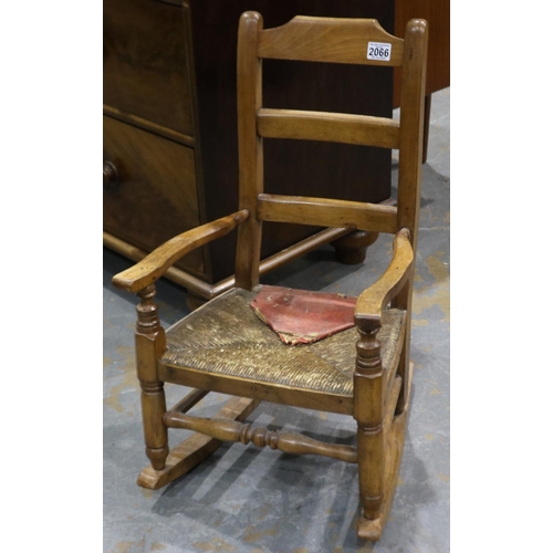 2066 - An early 19th century elm framed rocking chair of diminutive proportions, H:68cm