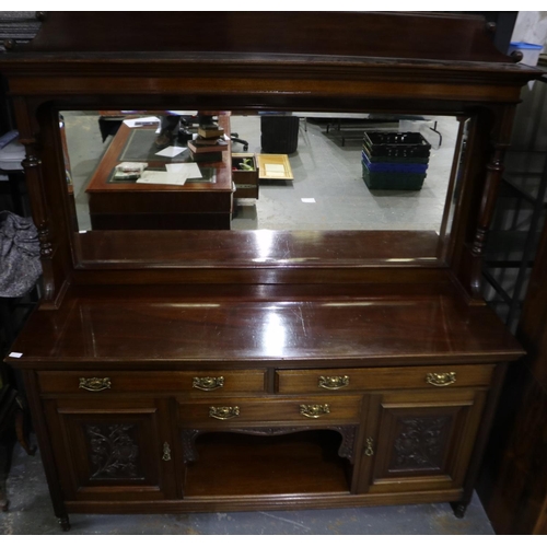 2071 - A Victorian mahogany open front sideboard with three drawers and two carved cupboard doors having a ... 