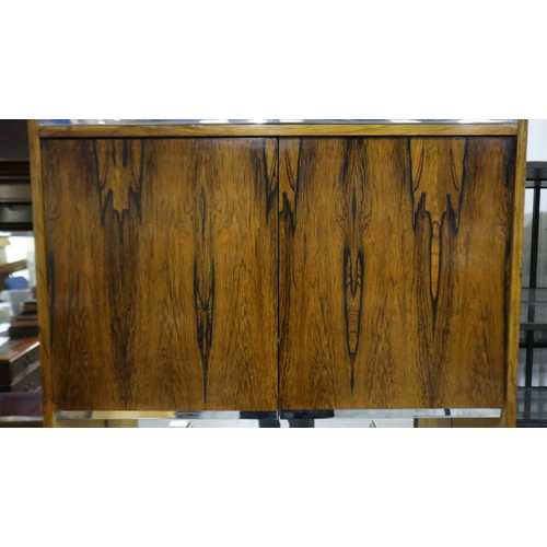 2104 - Richard Young for Merrow Associates rosewood drinks cabinet having four cupboard doors, two internal... 