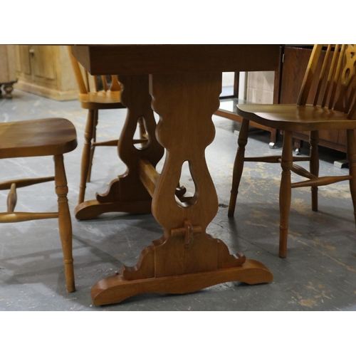 2090 - A mid 20th century golden oak drop leaf dining table, 128x117x76cm H, some small water marks to top,... 